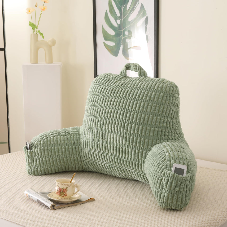 PAJEO reading pillow backrest with armrests supports posture while reading in bed.