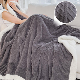 PAJEO Sherpa blanket with reversible design for versatile layering and cozy lounging.