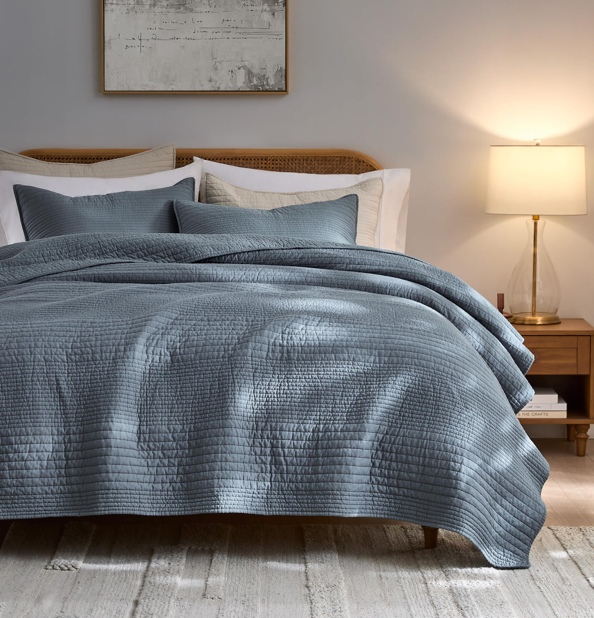 Palassio striped blue grey quilt cal king set on bed, breathable cotton for all-season comfort.