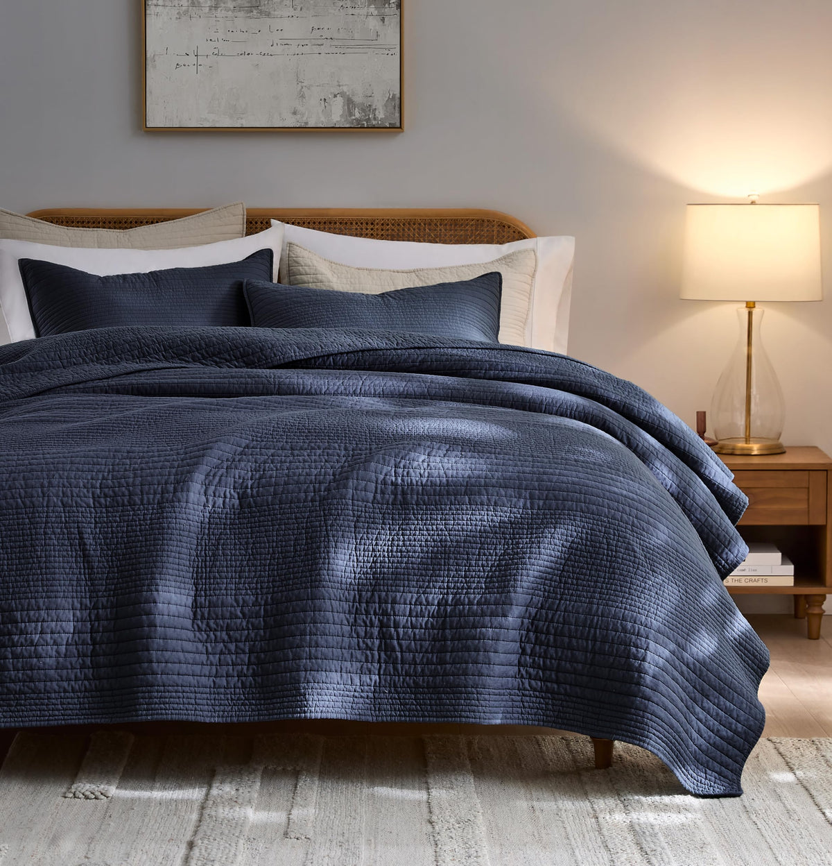 Palassio striped navy quilt on king bed highlighting lightweight cotton comfort