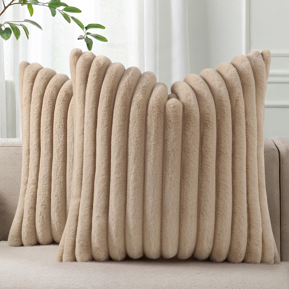 Pallene faux fur stripe pillow cover on sofa adds cozy texture.