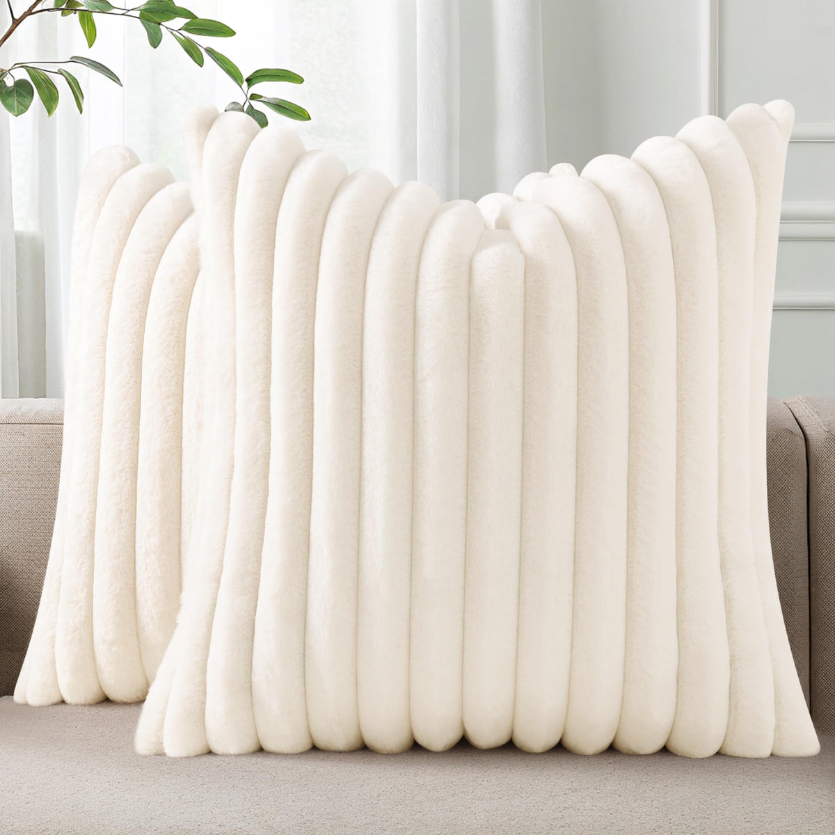 Pallene faux fur plush throw pillow cover in cream enhances sofa coziness