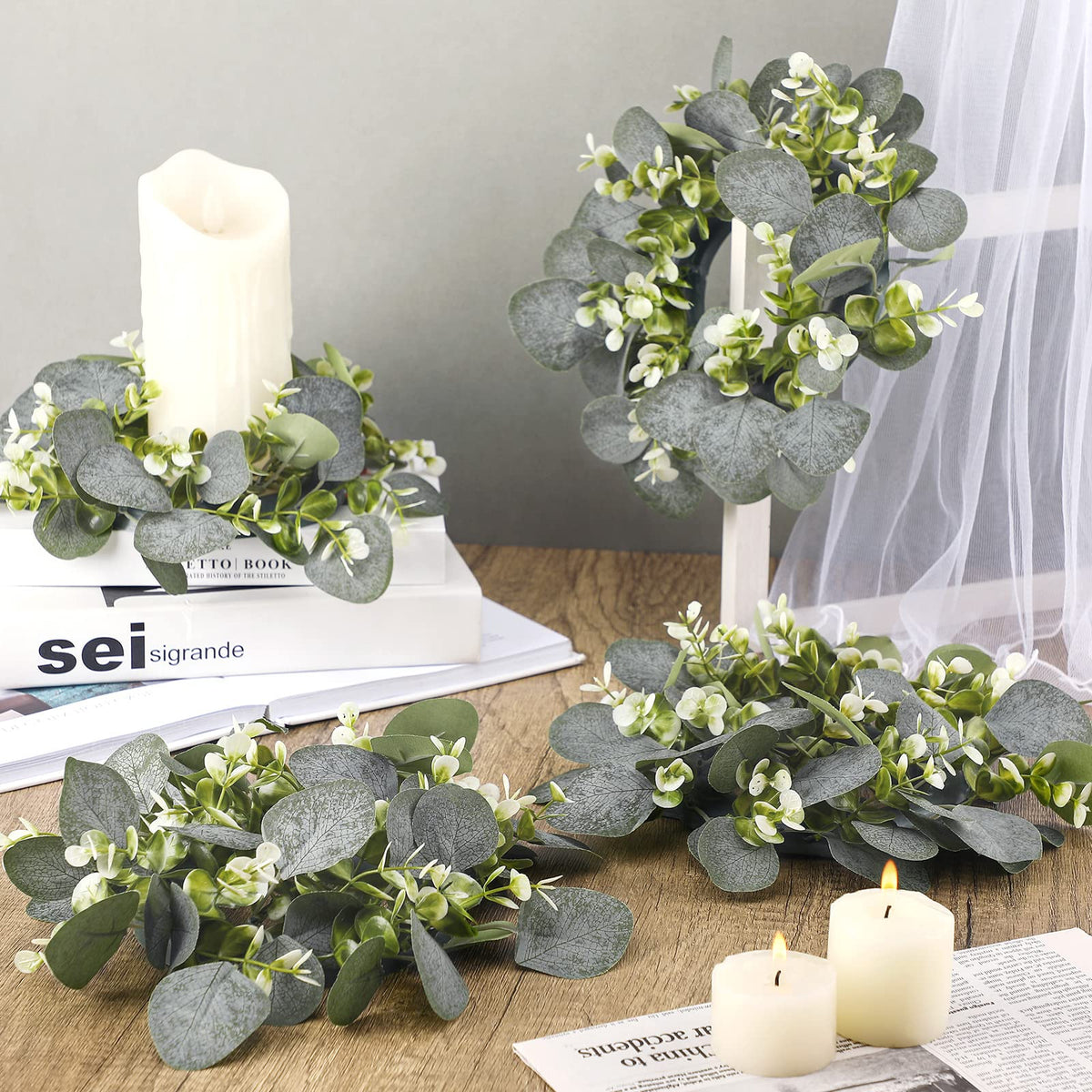 Panelee wedding setup with pillar candles using multiple rings for elegant ambience.