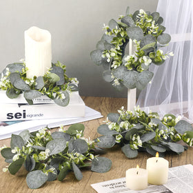 Panelee wedding setup with pillar candles using multiple rings for elegant ambience.