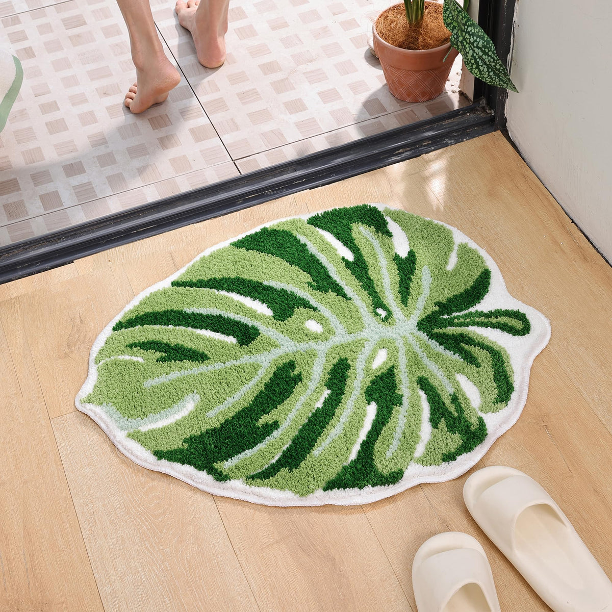 Panstar Large Monstera Tufted Rug stays in place on tile.