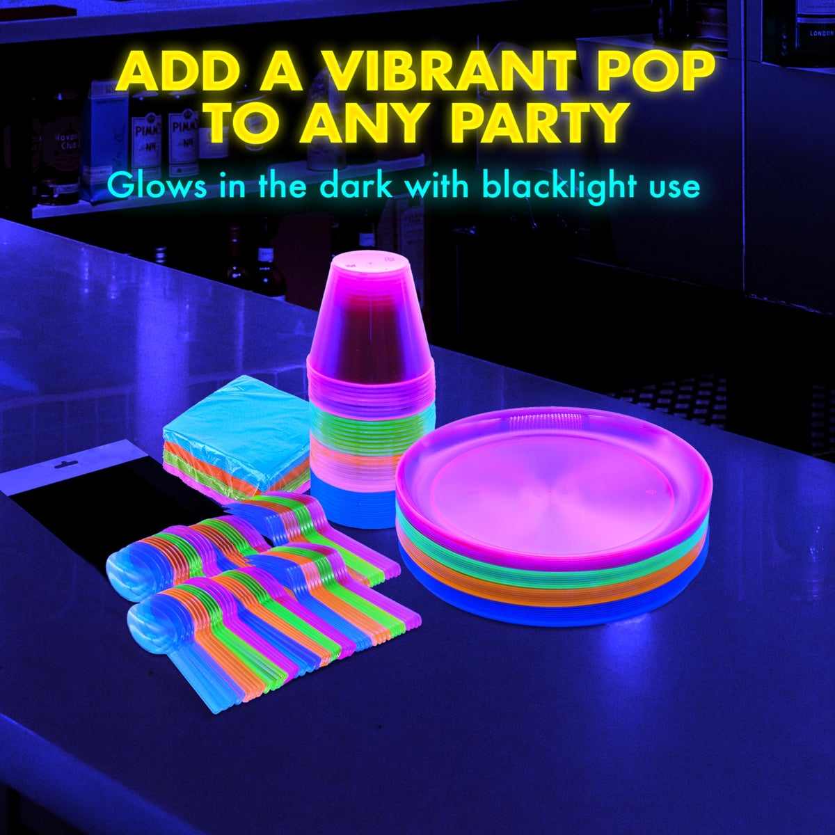 Party Essentials black table cover glows with neon tableware for bold party tables