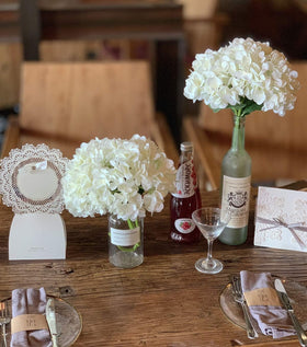 Wedding centerpiece idea with Party Joy white hydrangea and coordinating florals
