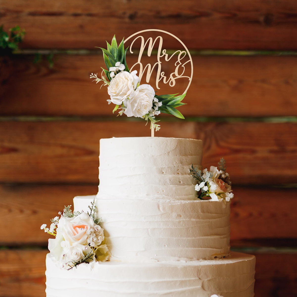 Party to Be green leaves detail enhances timeless wedding cake decoration.