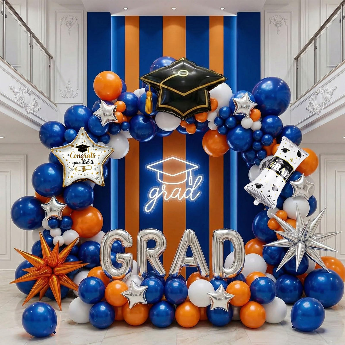 PartyMigo graduation arch with blue, orange and white balloons for a festive backdrop.