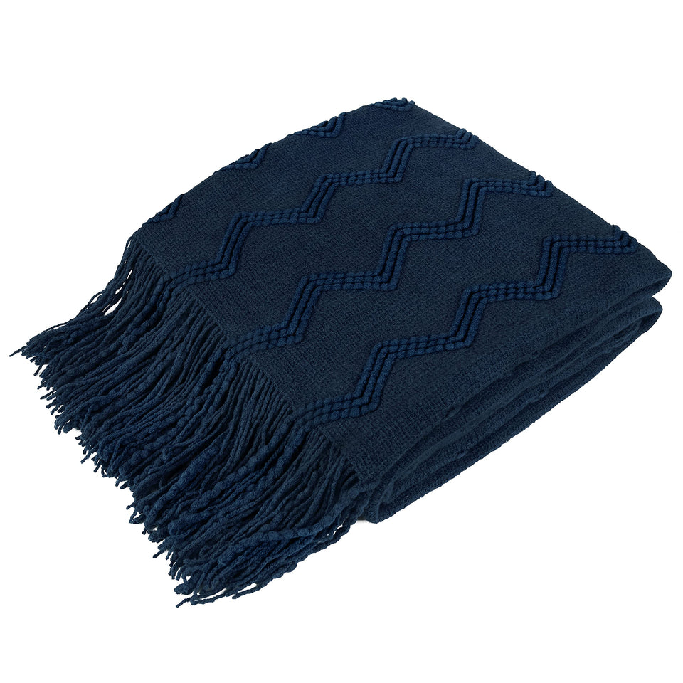 PAVILIA navy blue knit throw blanket close-up fringe detail for cozy decor.