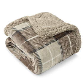 PAVILIA taupe plaid sherpa blanket on couch for extra warmth