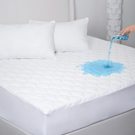 PDXM waterproof mattress protector on bed protects against spills and stains for peaceful nights
