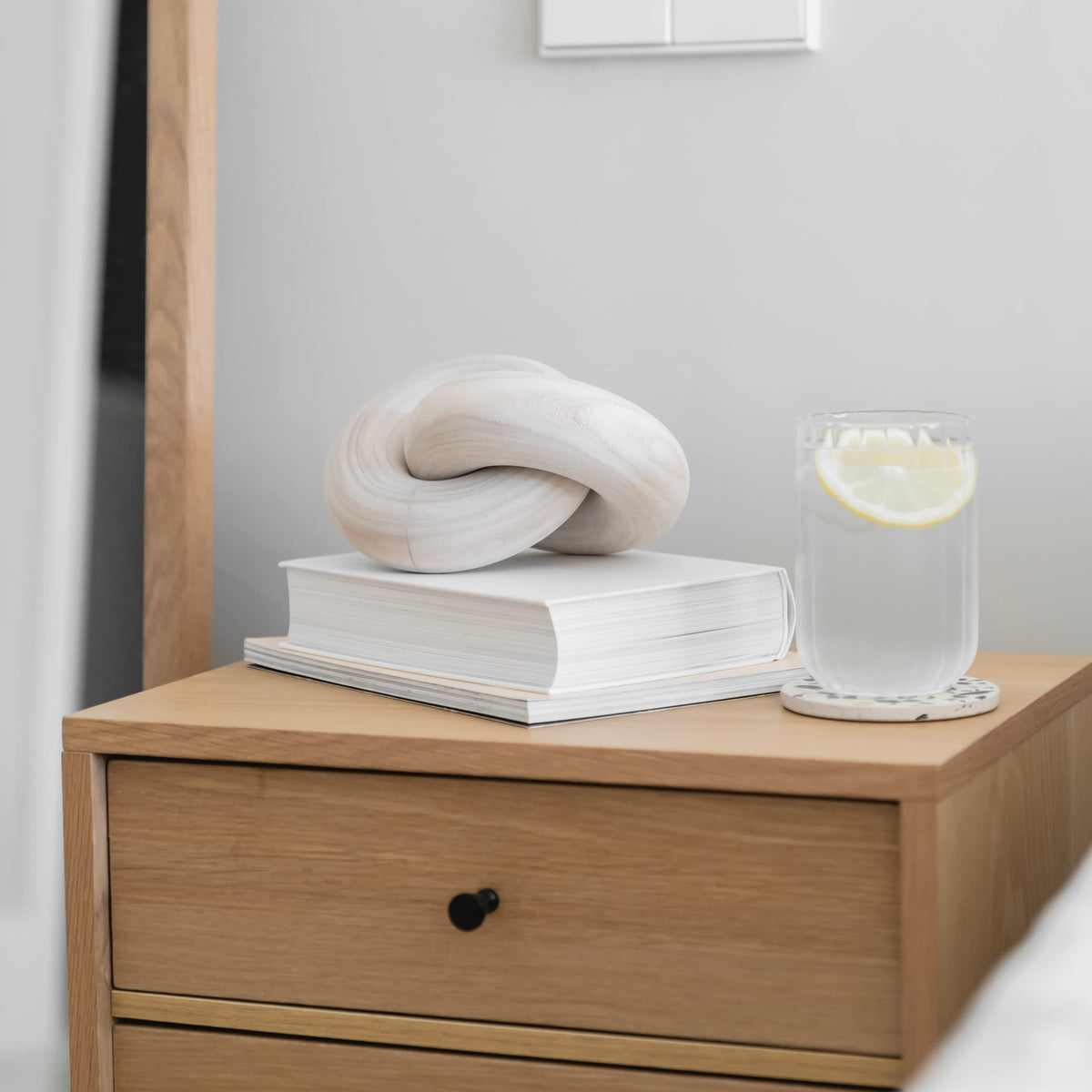 Peakoly wood knot decor on an entryway table for subtle sophistication