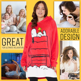 Woman wearing Peanuts Snoopy hoodie blanket for a relaxed movie night.