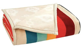 Close-up of soft plush fabric, Pendleton reversible throw, inviting warmth and texture.