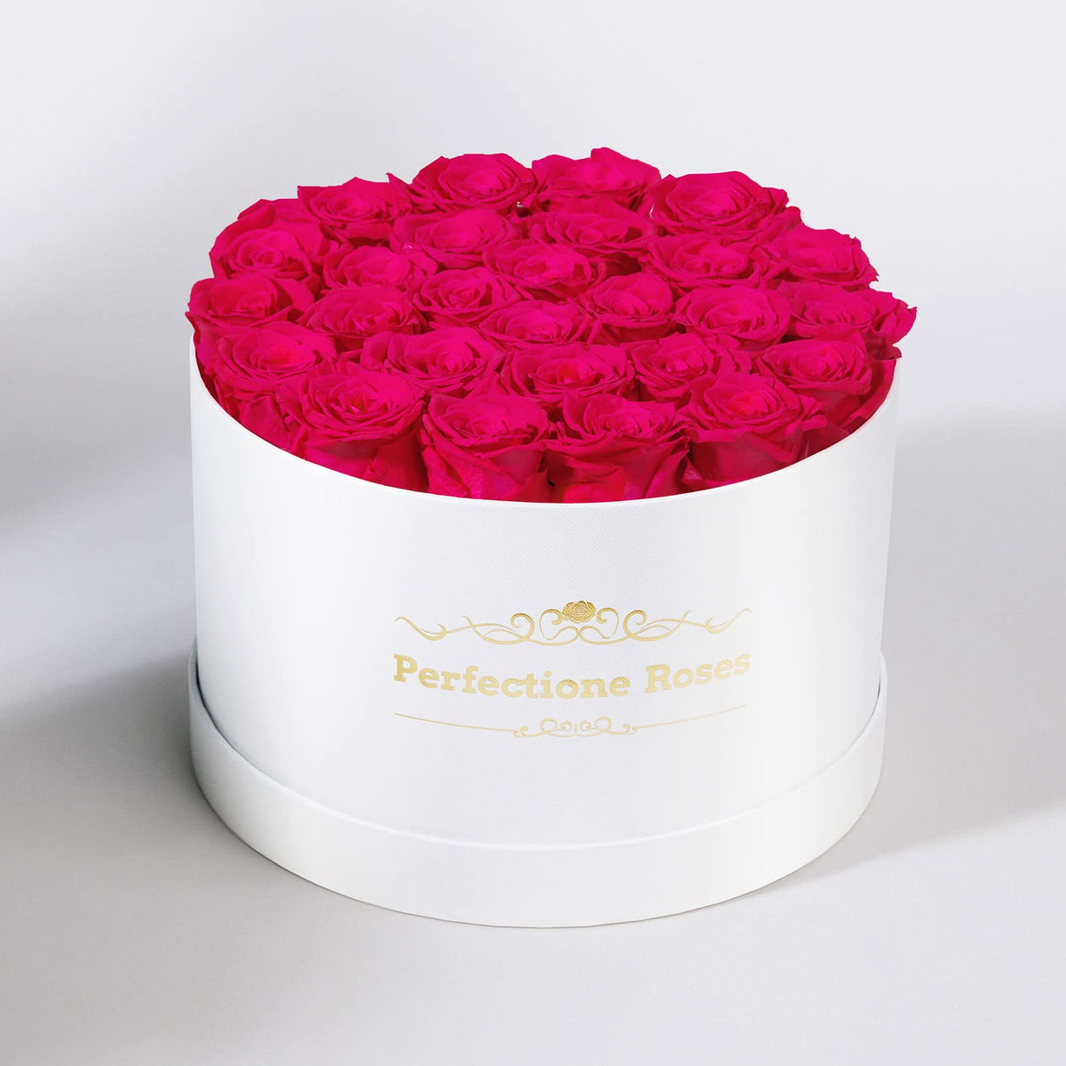Perfectione Roses radiant pink preserved roses in a round box, perfect for special occasions.
