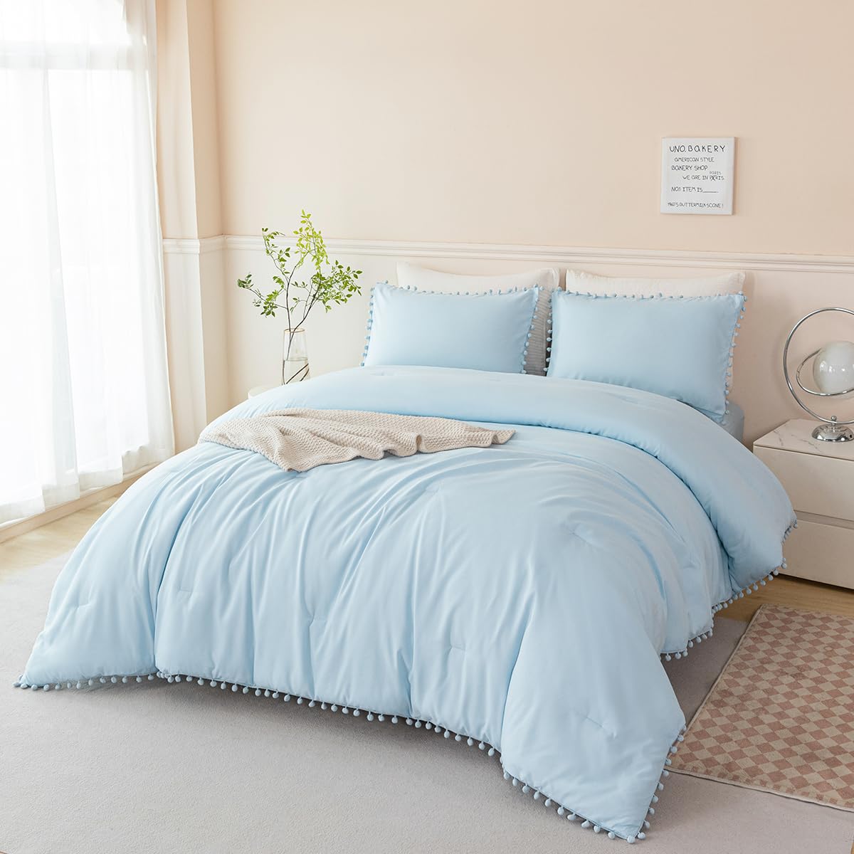 PERFEMET pom pom comforter adds soft texture and cozy style to the room.