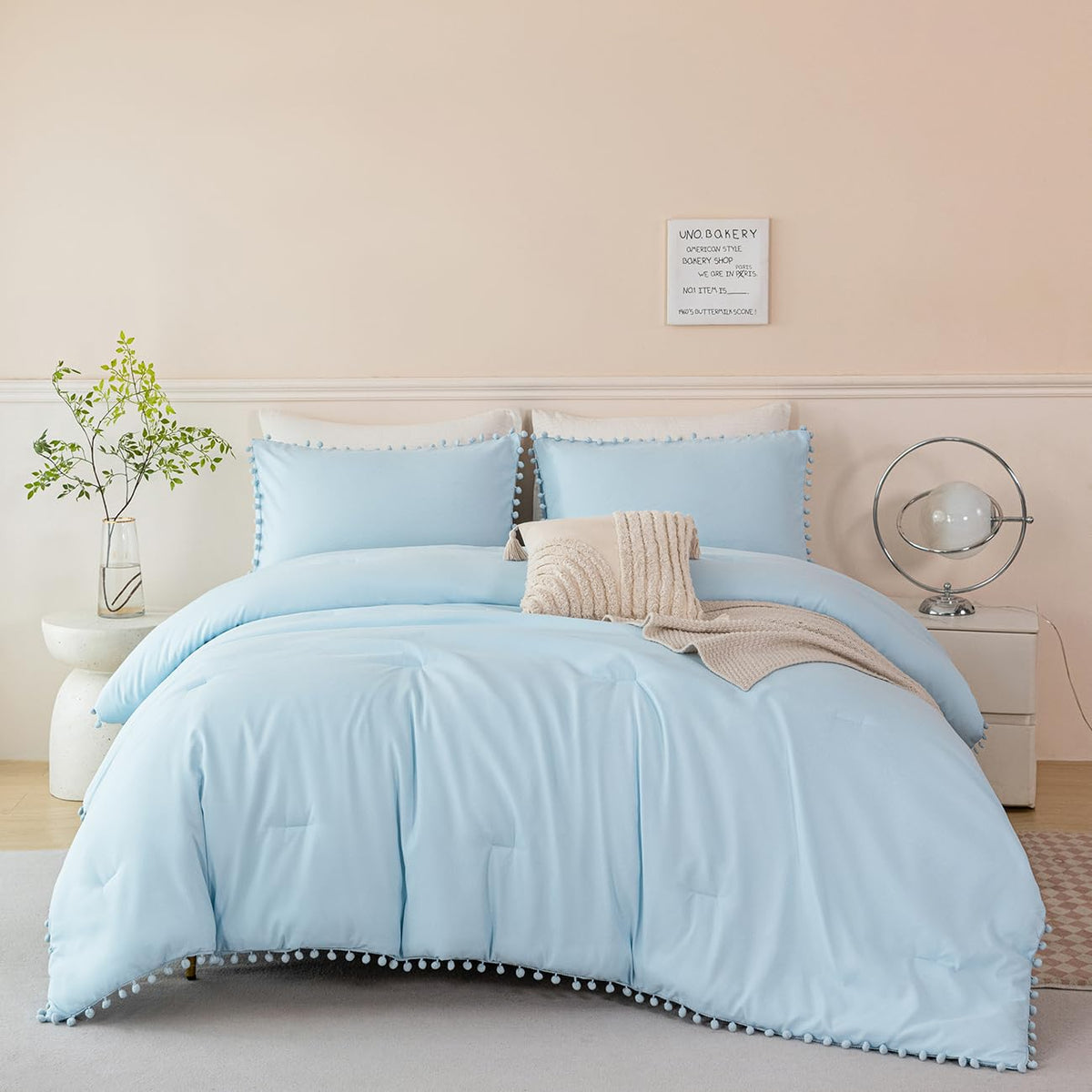PERFEMET pom pom pillowcases pair with the blue theme for added charm.