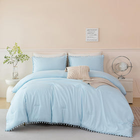 PERFEMET pom pom pillowcases pair with the blue theme for added charm.