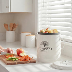 Perfnique cream-colored compost bin fits farmhouse and modern kitchens.