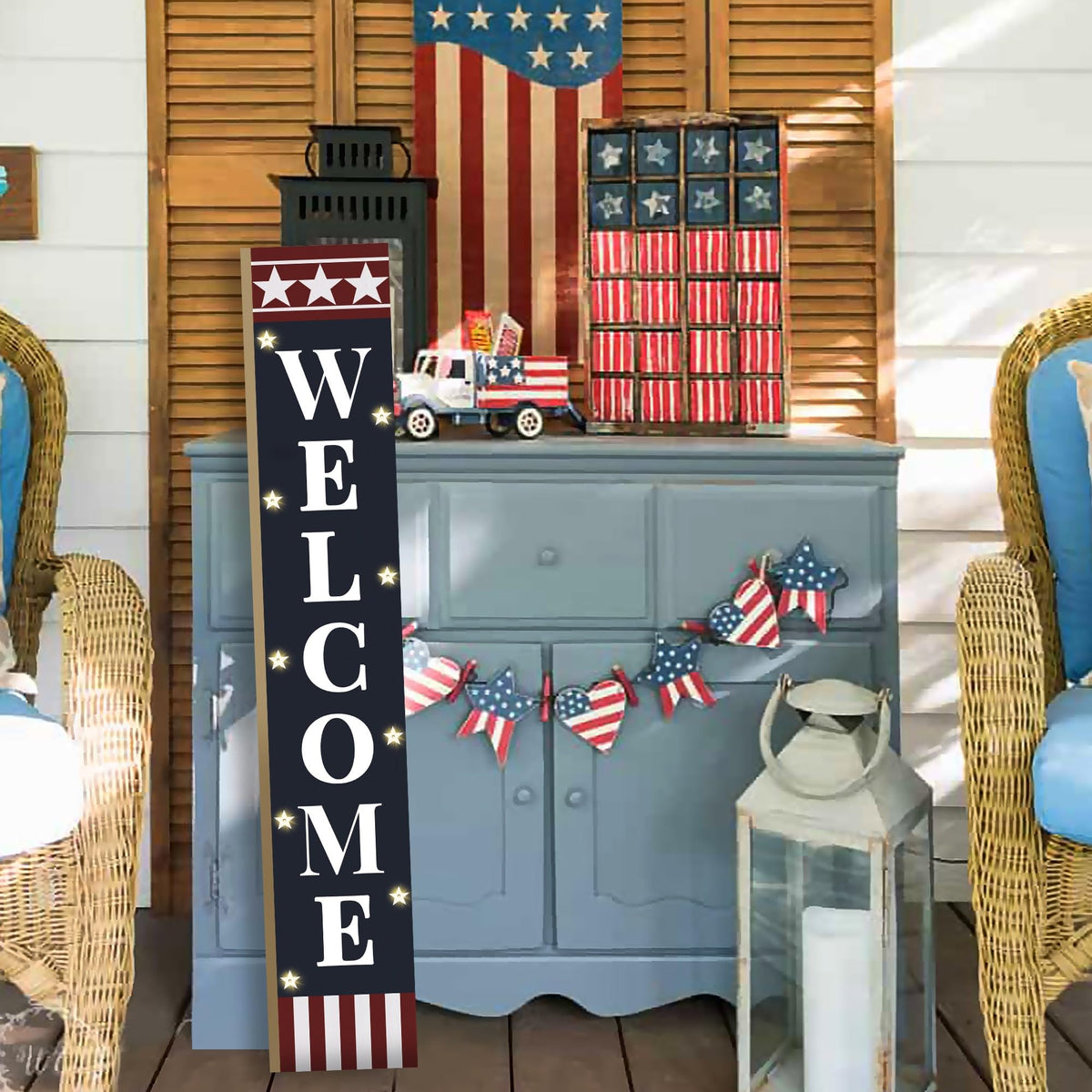 PEROUU front view of blue background with red stripes and WELCOME on porch sign