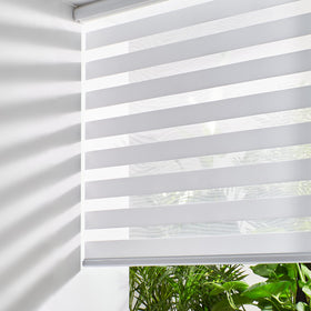 Persilux cordless zebra blinds with closed daylight-filtering for privacy.