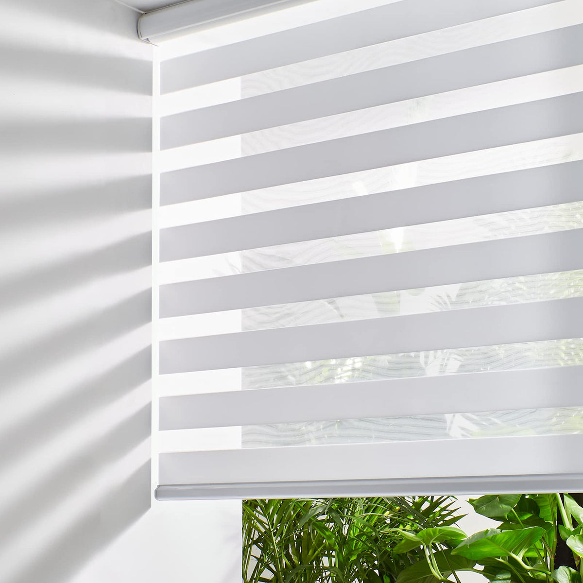 Persilux cordless zebra blind in white with dual-layer light control at window