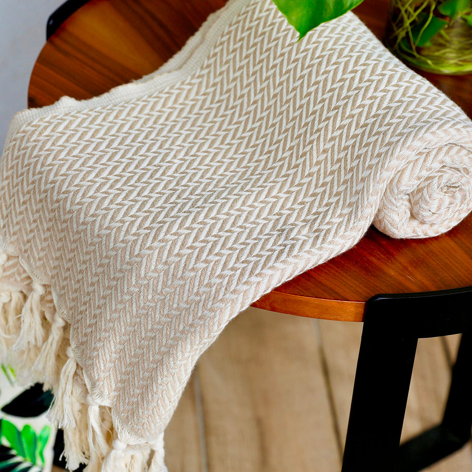 Peshtemania premium cotton Boho throw blanket on sofa adds cozy, stylish décor.
