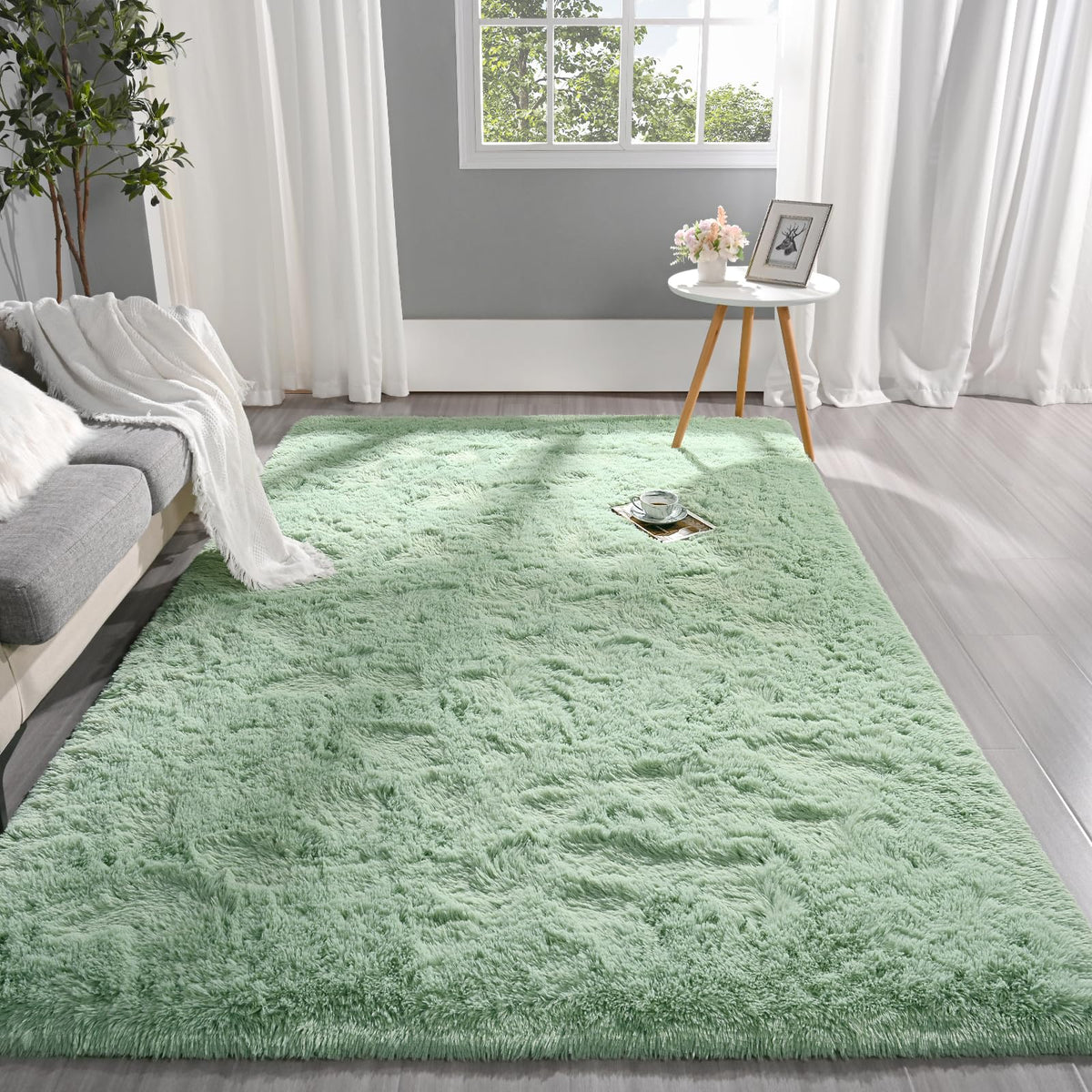 Pettop fluffy sage green area rug close-up fiber detail highlighting plush texture.