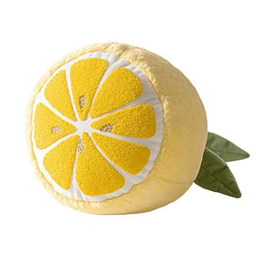 Phantoscope Lemon Shaped Throw Pillow on a bedside chair adds playful accent.