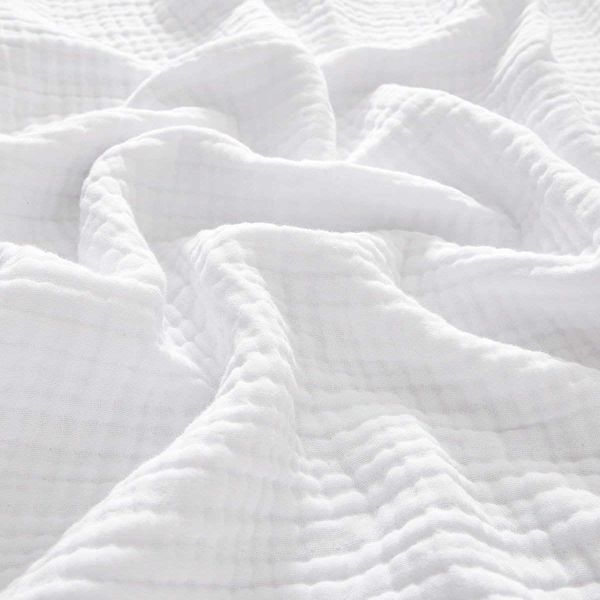 PHF cotton muslin blanket king size 108x90 on a bed, offering soft, breathable comfort.
