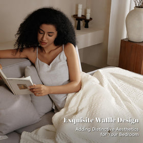 PHF cotton waffle blanket ivory draped-over-sofa suggests casual comfort and decorative appeal.