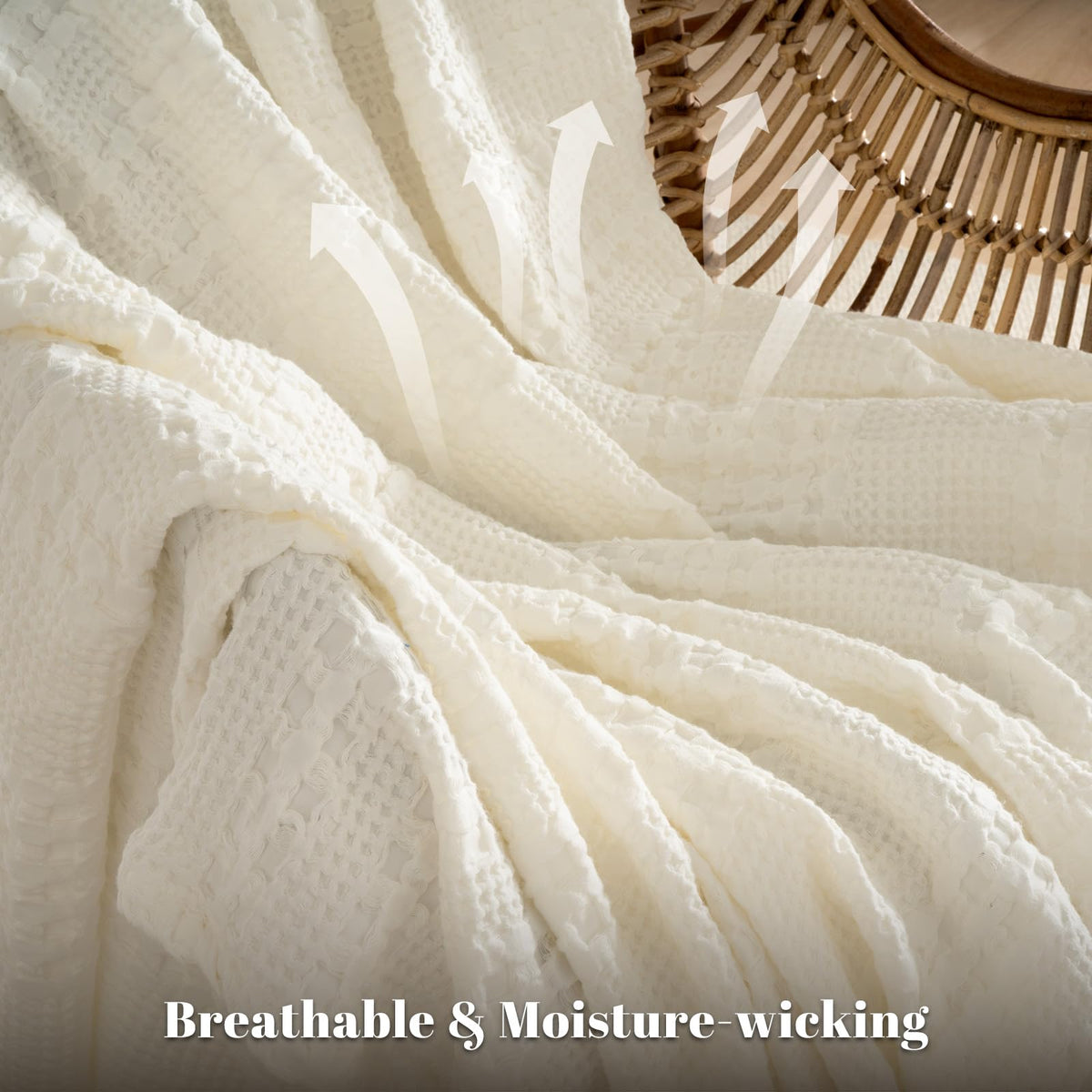 PHF cotton waffle blanket ivory folded-on-bed demonstrates compact storage and easy layering.