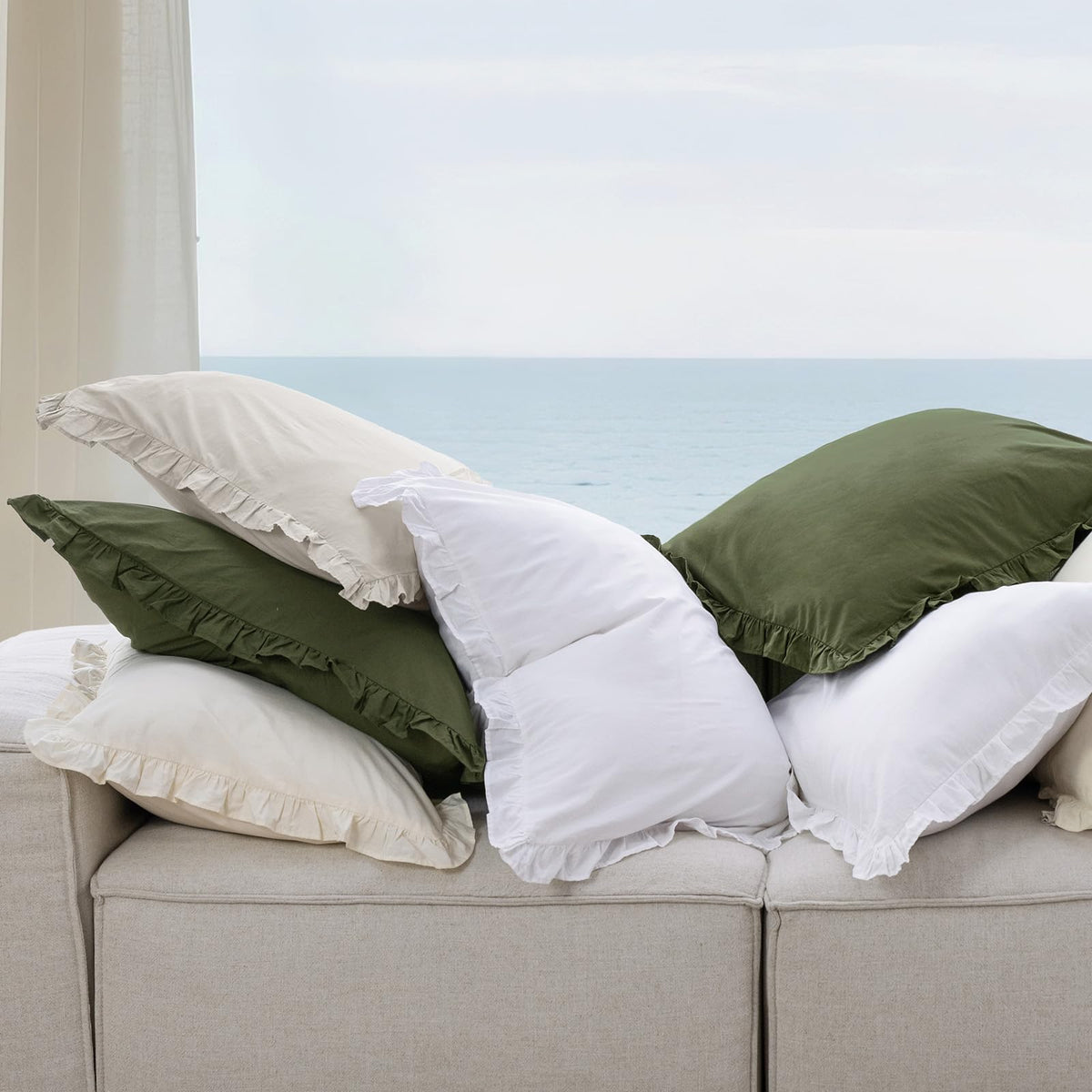 PHF farmhouse decor style using white euro shams on bed and sofa