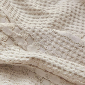 PHF waffle pillowshams oatmeal fabric featured in a calm bedroom setting