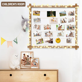 PHOENANCEE hanging photo display on wall offering easy rearrangement.