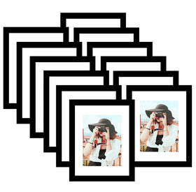 Picrit 12-pack of 8.5x11 frames with mat displaying 6x8 photos on wall