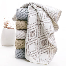 Pidada set of four towels neatly folded in bathroom decor