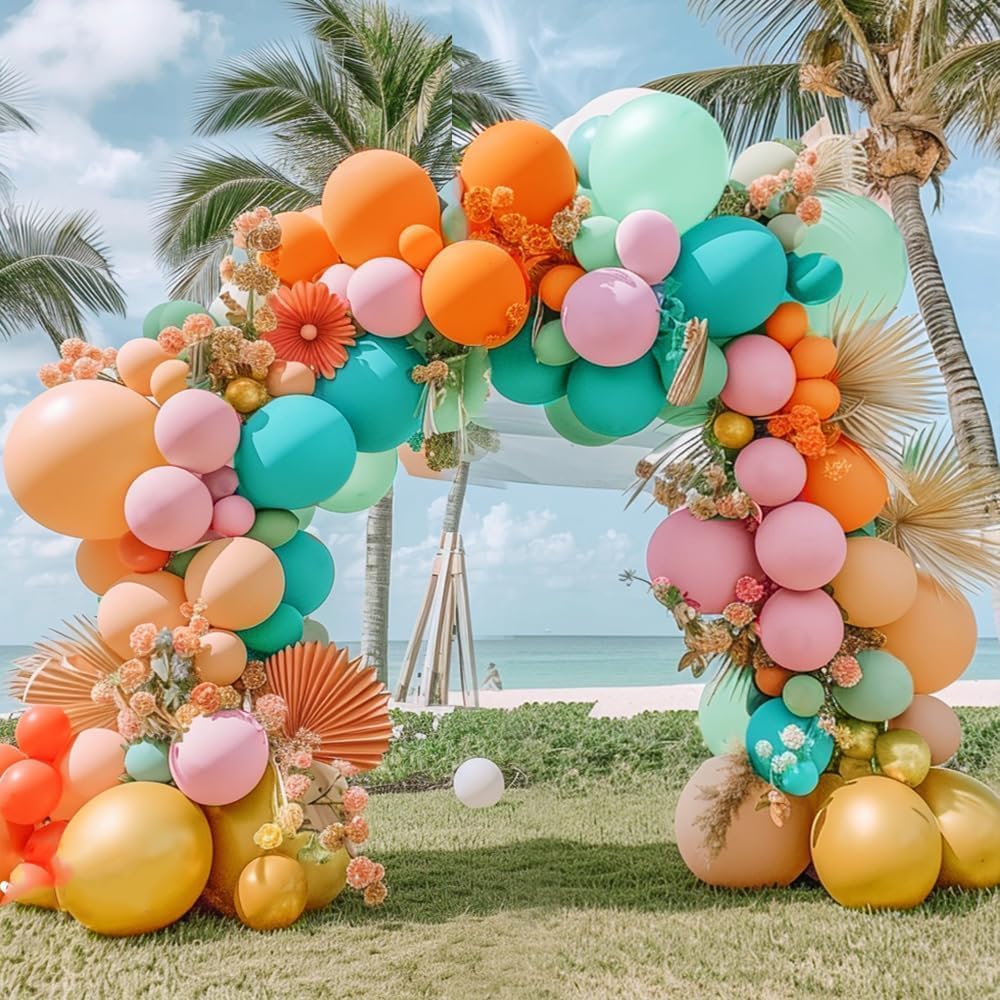 Pinbra pastel balloon arch with coral pink and teal for tropical decor.