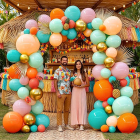 Pinbra turquoise blue and peach balloons brighten Hawaii-inspired decor.
