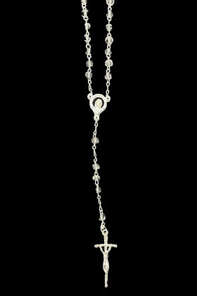 Pink Princess baptism rosary matches the set with a complementary finish.