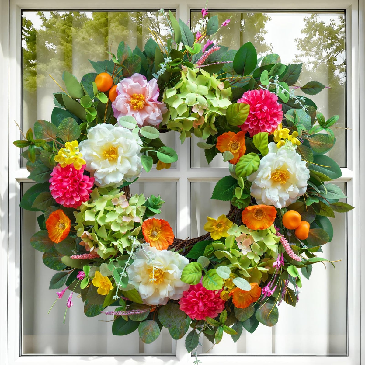 Pinkpuii wreath being fluffed before hanging for fuller effect