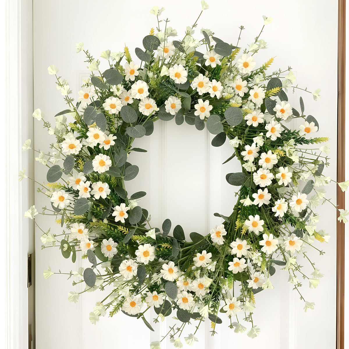 Pinkpum daisies with eucalyptus create a vibrant wall or door accent.