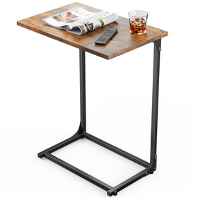 Pipishell C Shaped Side Table tucked under the sofa for easy reach and beverage placement