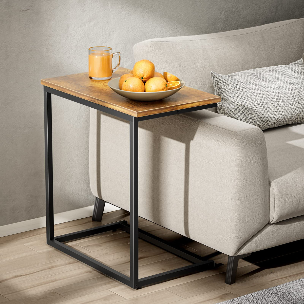 Pipishell under-sofa side table slides under the couch for quick access.
