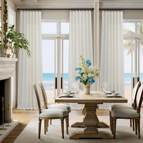 Pitalk semi-sheer cream panels create airy private ambiance