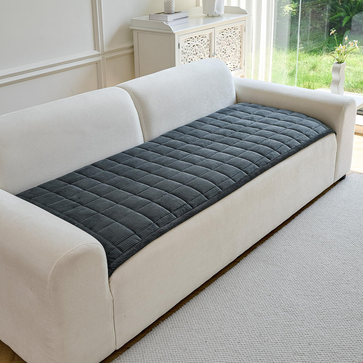 PJLZJFBY couch cover showing non-slip backing to prevent shifting on surfaces.