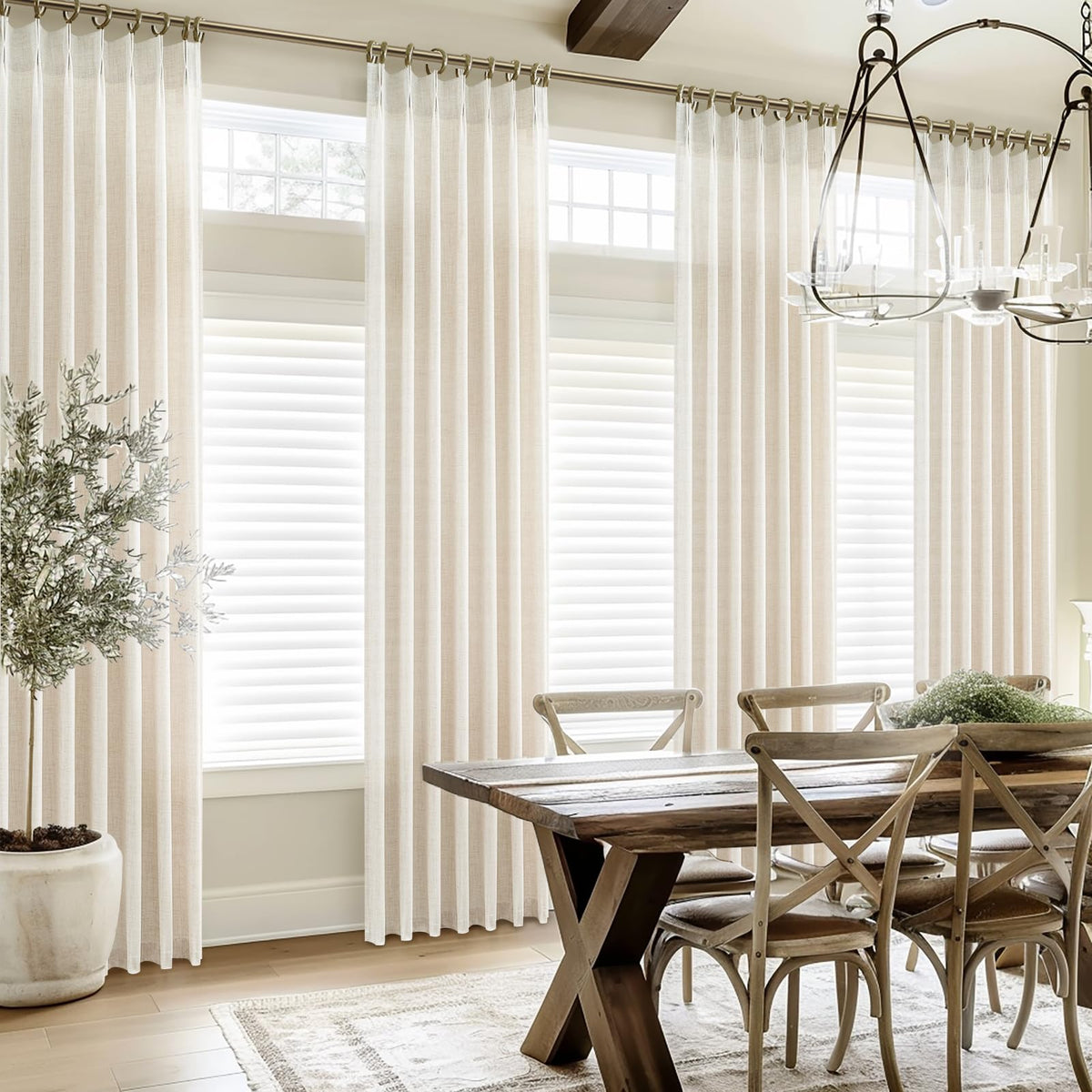 PleatedDrapes floor-to-ceiling curtains in living room setting.