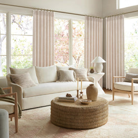 PleatedDrapes oatmeal beige fabric creating warm rustic room ambiance.