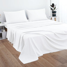 PLUSHY COMFORT luxury king flat sheet on bed demonstrates generous king size fit